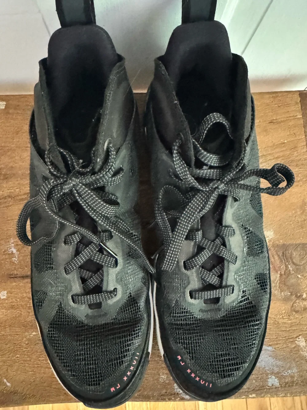 Boy’s Nike Air Jordan XXXVII Black Hot Punch basketball shoes.